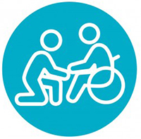 two people, one in wheelchair